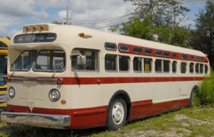 1950's integral frame bus painted in cream color with red stripes