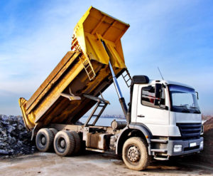 a dump truck unloading its cargo