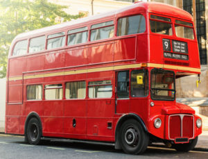 classic red London double-decker bus parked on a street