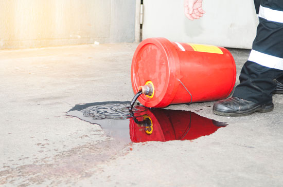 Los Angeles industrial accident lawyer is ready to help this worker exposed to toxic liquid spilled on the floor