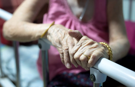 Los Angeles nursing home neglect lawyer can assist this elderly lady clutching the side rail of her hospital bed