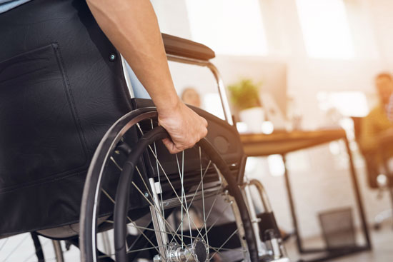 Los Angeles paralysis injury attorney will fight for this victim who is holding the wheel of his wheelchair