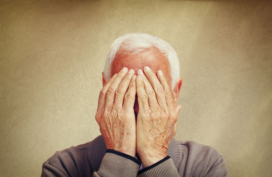 elderly gentleman covering his face with hands needs the nursing home neglect attorney Los Angeles trusts