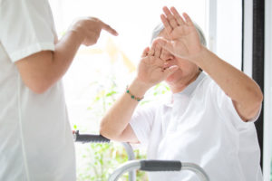 nursing home physical abuse attorney can assist this patient who is covering her face in fear of an angry nurse