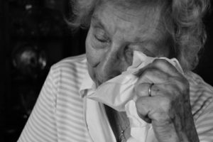 nursing home sexual assault attorney will fight for this elderly lady who is wiping her tears after being abused