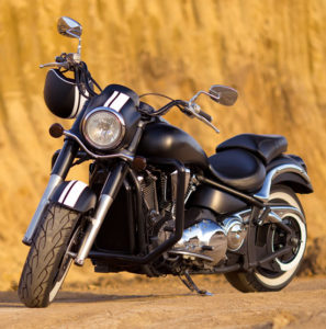 black power cruiser motorcycle parked on the side of a road