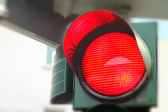 a brightly-lit street light that turned red