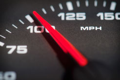 speedometer of a speeding car showing 100 miles per hour