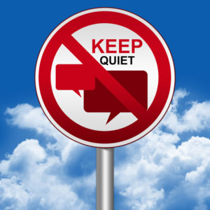 a red sign that says keep quiet