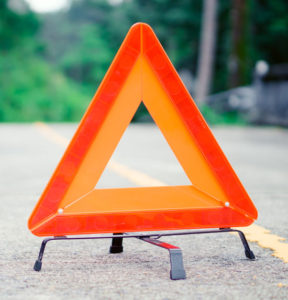 an orange traffic safety triangle