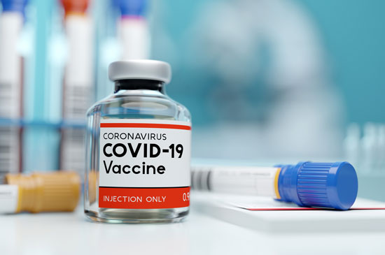 vial of COVID-19 vaccine and a syringe for elderly patients